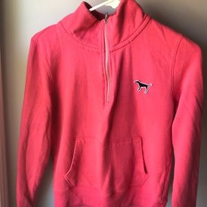 A pink turtleneck sweater